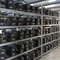 Miners meticulously configuring their mining rigs within a bustling mining farm