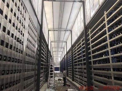 A large mining farm with rows of servers.